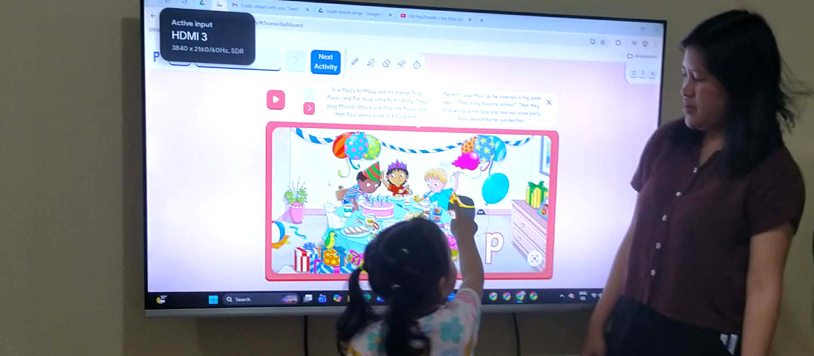 Teacher guiding a young learner